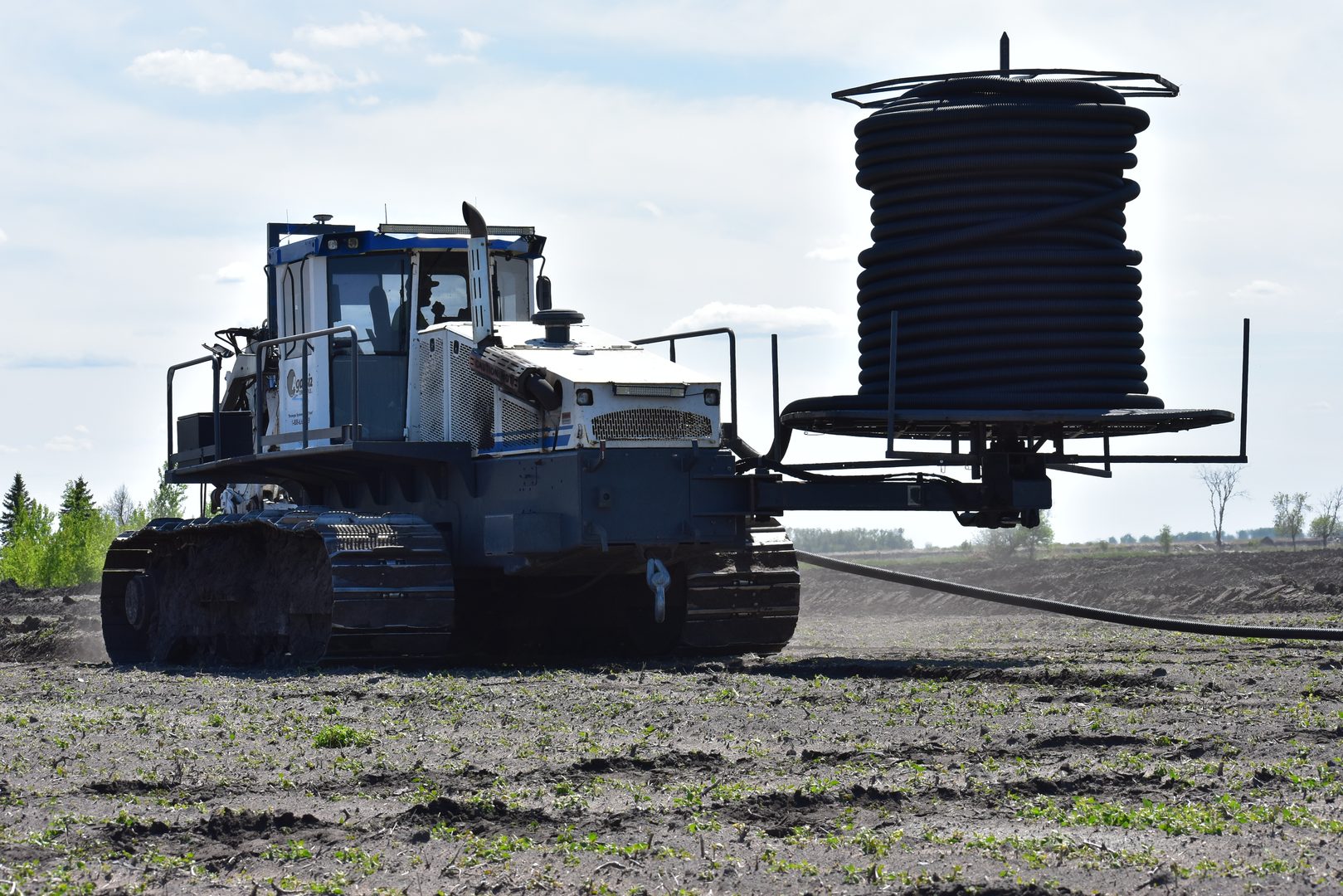 Drain tile installation equipment in field